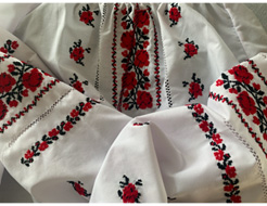 The photograph is a traditional Ukrainian embroidered blouse for women called vyshyvanka.